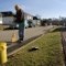 George Simons proudly cleans the street in front of his house on 5th Street in Jacksonville, Ohio.