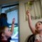 Shayla plays with her younger brother Jacob in the family kitchen.